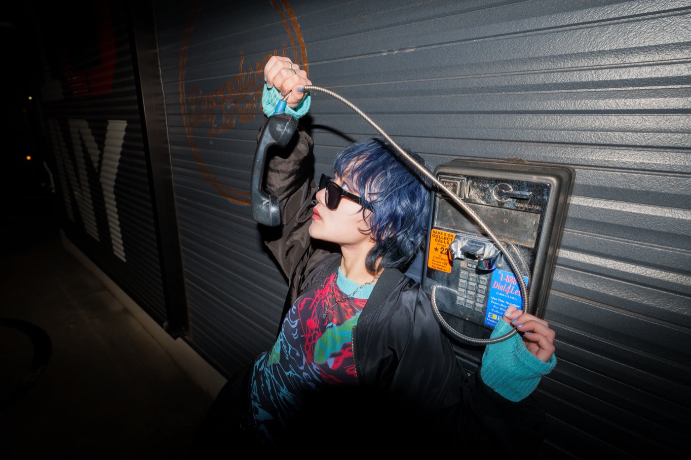 Artist photo for Hi,Me:), shot at night by a payphone